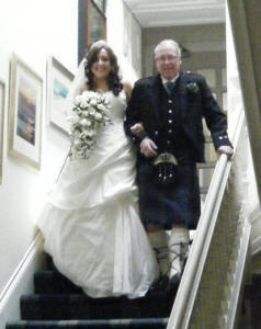 Laura and Dad on the way to the ceromonyl with James A Nicholl Scottish Piper at their wedding at Strathblaine Country House Hotel